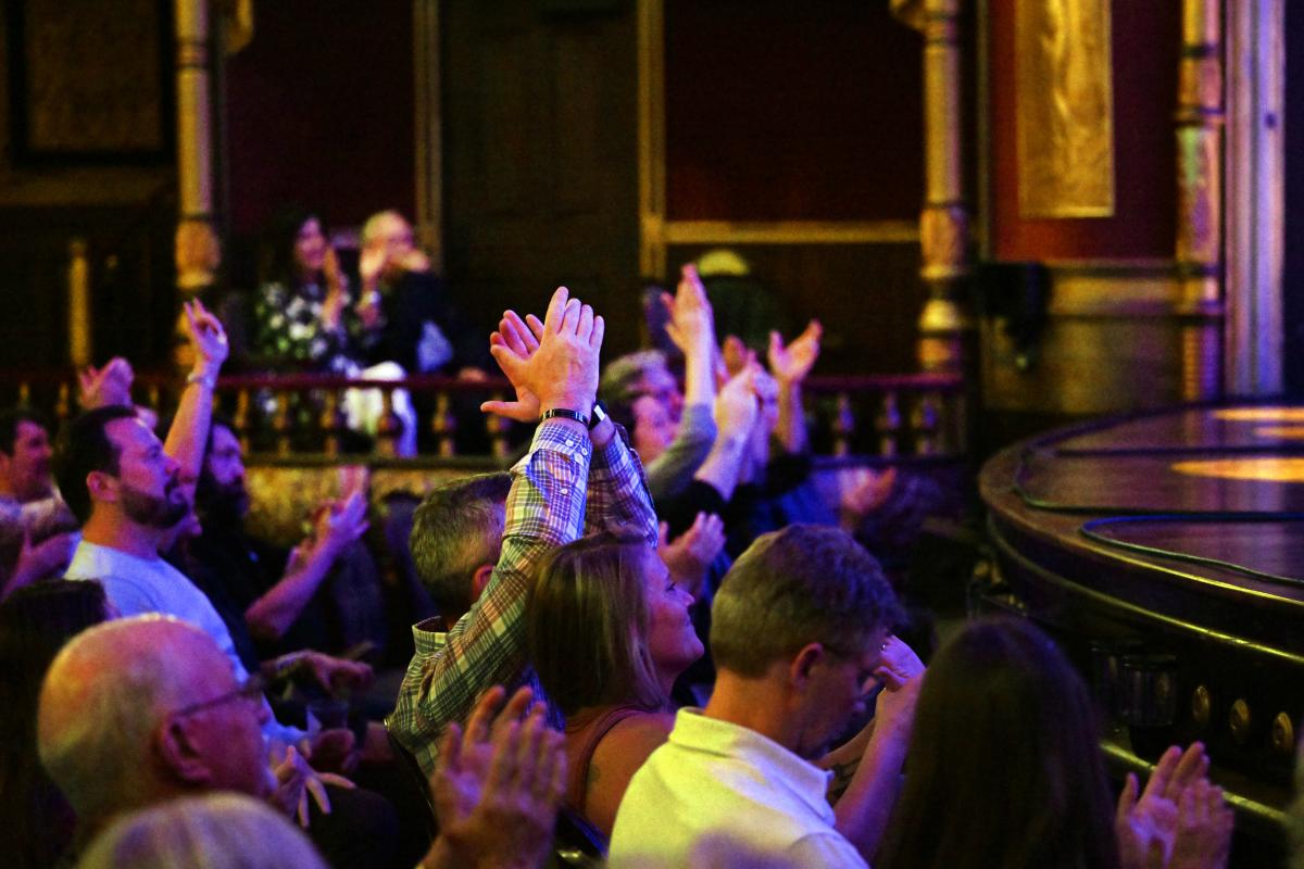 Audience clapping in the MSU Riley Center Historic Theatre